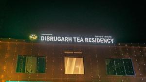 a building with a sign on top of it at Dibrugarh Tea Residency in Dibrugarh
