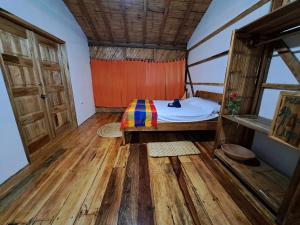 Voodi või voodid majutusasutuse Hostal Olmito Canoa toas