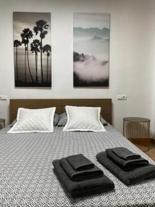 a bedroom with a bed with two towels on it at el toro in Finestrat