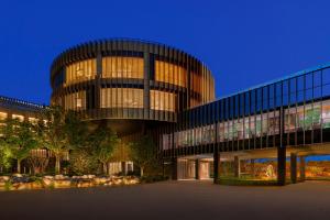 a large building with a lot of windows at night at Artyzen Lingang Shanghai in Shanghai