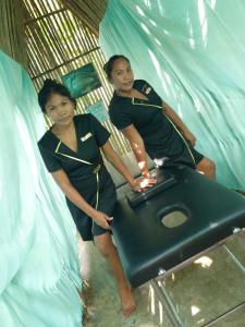 two women sitting on a bed in a tunnel at Camotes-Hidden-Huts in San Francisco