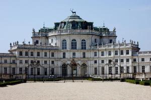 a large building with a gate in front of it at Torino Hotel San Luigi - Ristorante Trait d'Union in Beinasco