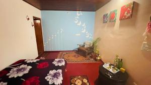 Postel nebo postele na pokoji v ubytování Madan Homestay