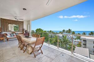 a dining room with a view of the ocean at Stunning 2-3 Bed Penthouse Glorious Ocean Views in Trinity Beach