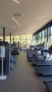 a gym with rows of treadmills and machines at Las Colinas Golf in Orihuela Costa