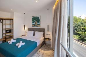 Posteľ alebo postele v izbe v ubytovaní Iconic Athens Suites