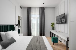 Posteľ alebo postele v izbe v ubytovaní Valens Residence