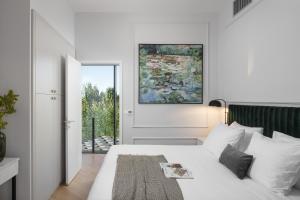 Posteľ alebo postele v izbe v ubytovaní Valens Residence