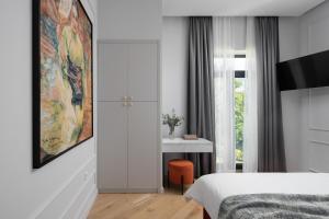 Posteľ alebo postele v izbe v ubytovaní Valens Residence