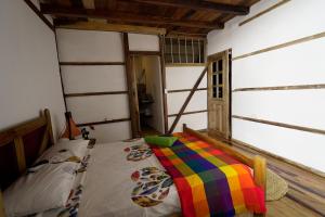 Voodi või voodid majutusasutuse Hostal Olmito Canoa toas