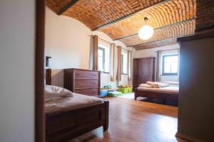 a bedroom with two beds and a ceiling at APARTMÁNY MAXOV in Lučany nad Nisou