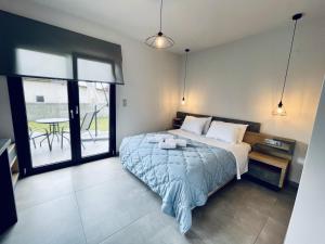 Voodi või voodid majutusasutuse TheaSea Luxury Suites - Kallikrateia Halkidiki toas