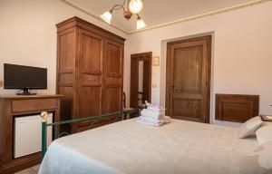 TV a/nebo společenská místnost v ubytování Agriturismo La Rocca Assisi