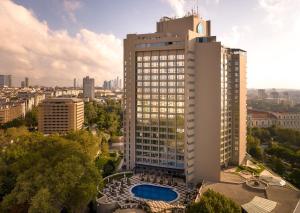 a tall building with a pool in front of it at InterContinental Istanbul, an IHG Hotel in Istanbul