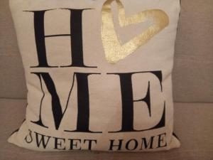 a pillow with the words sweet home on it at With Free Parking - The Boheme Navigli Junior Suite - Quiet & comfy vintage Junior Suite with cozy balcony - 5th attic floor lift to 4th floor - metro' verde -green subway Porta Genova in Milan