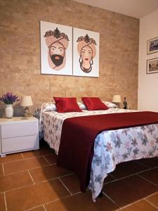 Кровать или кровати в номере Zisa Home ai Cantieri Culturali
