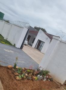 a house with a garden in front of it at The Unit Party House in eNyalungu