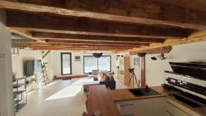a large living room with a couch and a table at Beau T4 au cœur du centre ville in Narbonne