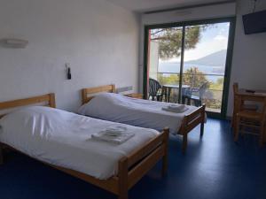 Postel nebo postele na pokoji v ubytování Village Vacances Lou Castelet + 17 fotografií