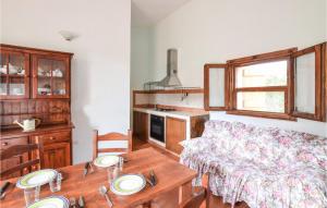 a living room with a table and a couch at Pet Friendly Home In Sedini With Kitchen in Sedini