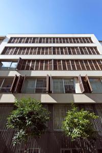 a tall building with two trees in front of it at NOA - Sungu 1 in Istanbul