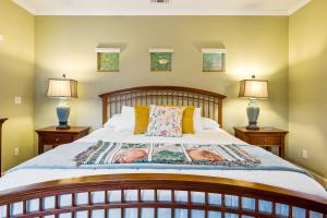 a bedroom with a large bed with two lamps at Berry House in Arroyo Grande