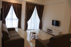 TV a/nebo společenská místnost v ubytování ATS Cameron Hotel & Apartments