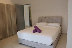 Postel nebo postele na pokoji v ubytování ATS Cameron Hotel & Apartments
