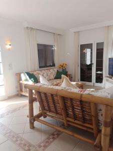 a living room with a couch and a table at VILLA ANGELINA in Playa Blanca