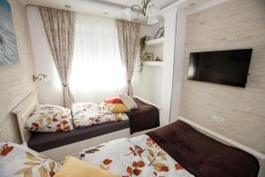 Krevet ili kreveti u jedinici u okviru objekta Apartman MDB RETRO