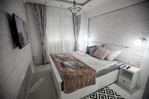 Krevet ili kreveti u jedinici u okviru objekta Apartman MDB RETRO