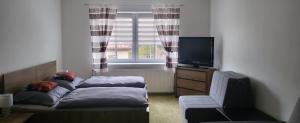 Postel nebo postele na pokoji v ubytování Apartmán DANY Hanušovice