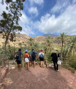 a group of people standing on a dirt trail at Surf Therapy in Agadir