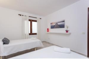 Posteľ alebo postele v izbe v ubytovaní YourHouse Casa Suiza