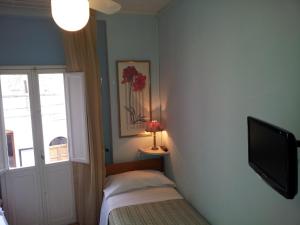 Cama o camas de una habitación en I Colori di Assisi