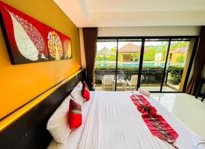 Postel nebo postele na pokoji v ubytování Naiyang Beach Hotel SHA Plus