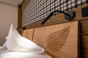 Postel nebo postele na pokoji v ubytování Hotel OTP Birkenhof