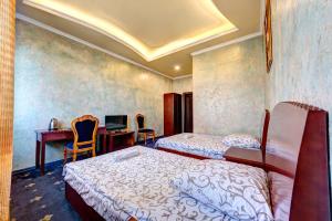 Giường trong phòng chung tại Hotel Kiev Lomakin