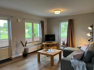 TV a/nebo společenská místnost v ubytování Flair Landhotel Strengliner Mühle