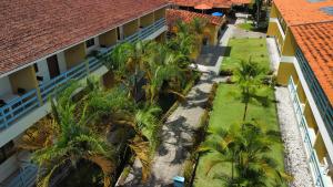 an aerial view of the courtyard of a building with palm trees at Bonito Plaza Hotel in Bonito +24 photos