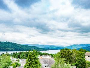 a view of a lake with mountains in the distance at Gorgeous cottage in Bowness in Bowness-on-Windermere