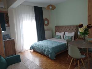 Ένα ή περισσότερα κρεβάτια σε δωμάτιο στο DREAM HOME