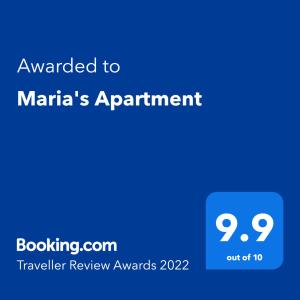 Ett certifikat, pris eller annat dokument som visas upp på Maria's Apartment