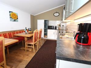 a kitchen with a table and a counter top at Rudigier in Kappl
