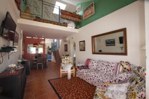 a living room with a couch and a table at Dar Saioa in Torrevieja