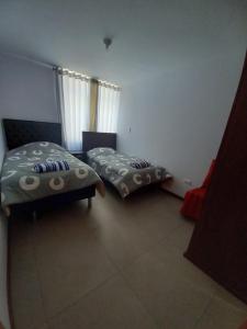 Uma cama ou camas num quarto em Yanahuara apartments