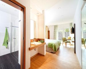 Postel nebo postele na pokoji v ubytování Hotel Schönau