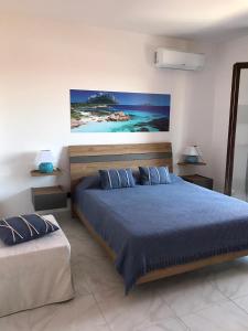 Postel nebo postele na pokoji v ubytování B&B I Colori Dell'Isola