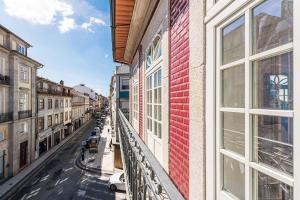 a view of a street from a balcony of a building at Cedofeita Balcony in Porto