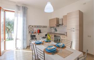 a kitchen and dining room with a table and chairs at 2 Bedroom Beautiful Home In Corridonia in Corridonia